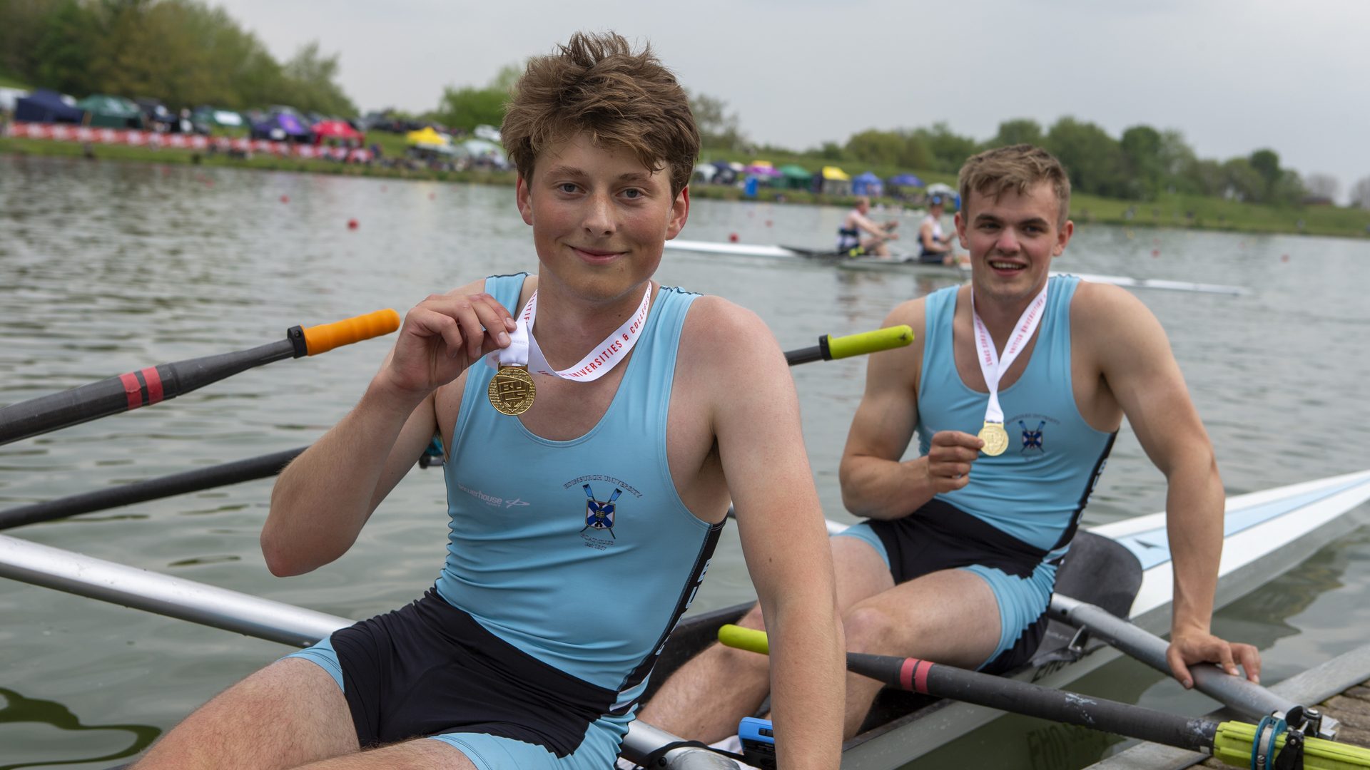 Edinburgh rowers on the water with their gold medals